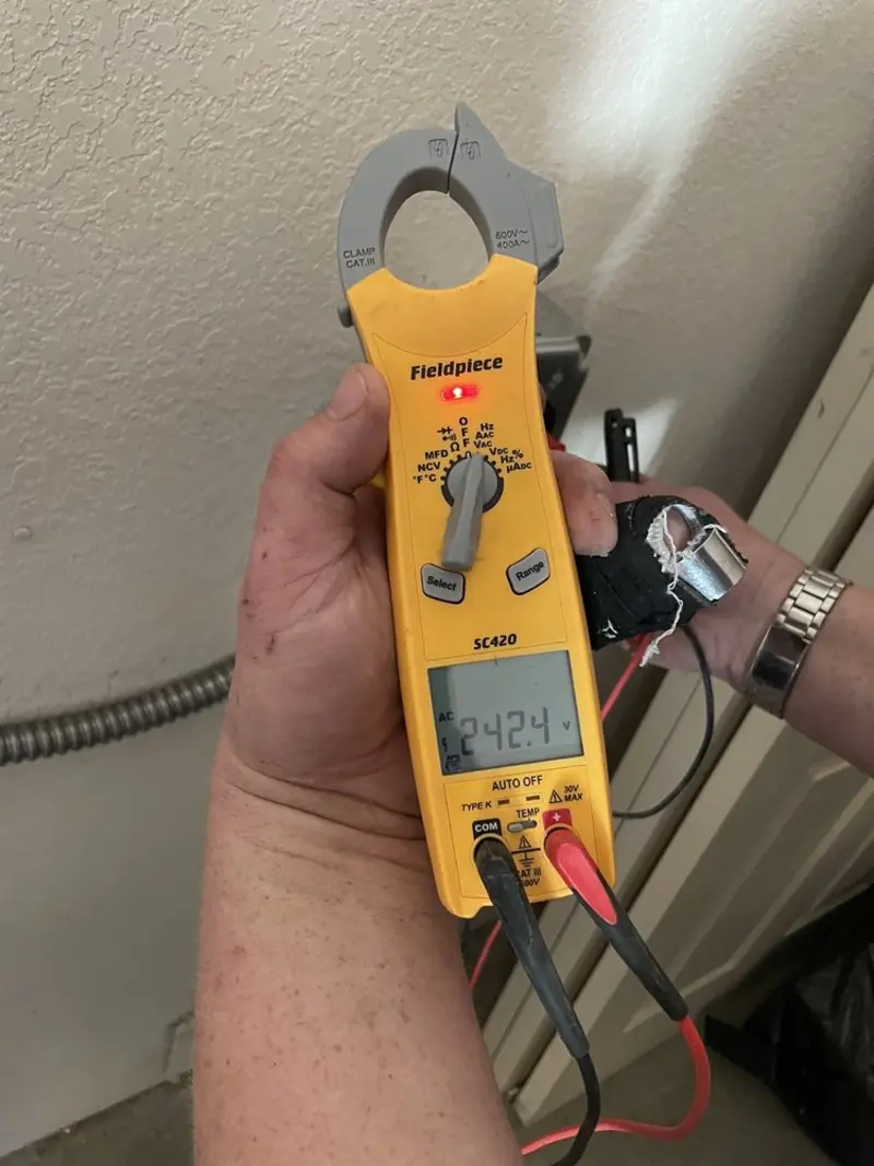 Voltage testing with clamp meter during Ceiling Fan Installation in Grafton